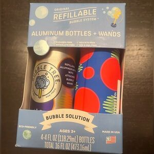 NEW, never opened Bubble tree- 4 4oz refilllable aluminum bubbles and wands